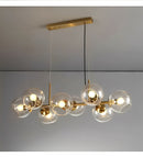 Bring timeless elegance to your home with the Modern Bubble Glass Chandelier – Copper Linear Pendant Light, a luxurious modern lighting fixture designed to elevate large living rooms, dining areas, staircases, and contemporary upscale interiors. Featuring high-transparency bubble glass shades combined with a premium forged copper structure, this chandelier blends artistic design with powerful LED illumination. Each bubble glass sphere refracts light beautifully, creating a warm, sophisticated glow that enha