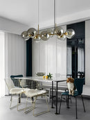 Bring timeless elegance to your home with the Modern Bubble Glass Chandelier – Copper Linear Pendant Light, a luxurious modern lighting fixture designed to elevate large living rooms, dining areas, staircases, and contemporary upscale interiors. Featuring high-transparency bubble glass shades combined with a premium forged copper structure, this chandelier blends artistic design with powerful LED illumination. Each bubble glass sphere refracts light beautifully, creating a warm, sophisticated glow that enha